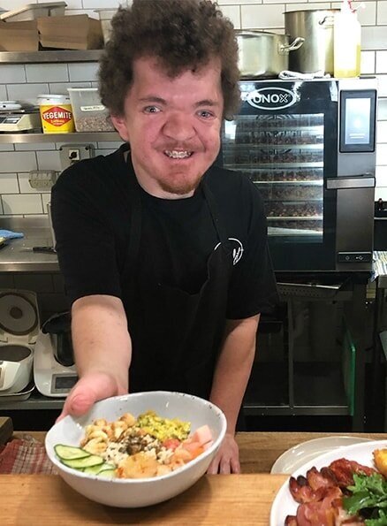 Clayton, one of Hamlet's participants, serving a meal.